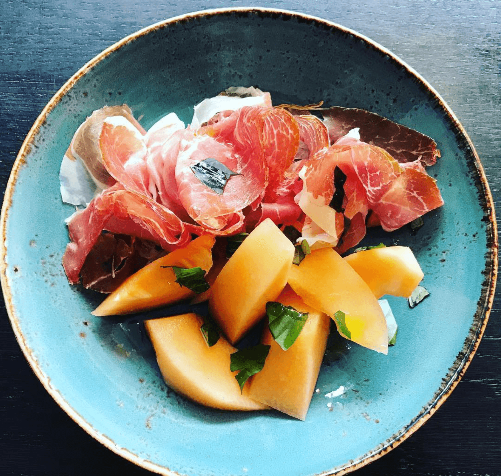 Prosciutto e Melone — Italian cured Parma ham with sweet cantaloupe melon and fresh basil